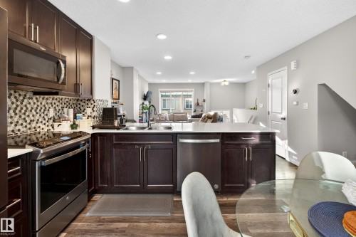 103 3305 Orchards Link Link, Edmonton, AB - Indoor Photo Showing Kitchen With Double Sink With Upgraded Kitchen