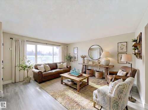 Living area with light wood finished floors - 11357 22 Avenue, Edmonton, AB - Indoor Photo Showing Living Room