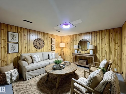 Living area with wooden walls - 11357 22 Avenue, Edmonton, AB - Indoor Photo Showing Living Room
