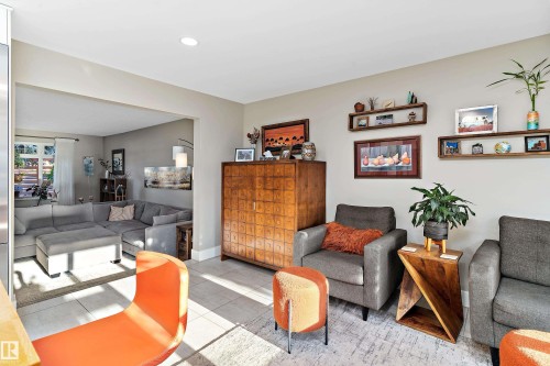 Living room featuring tile patterned flooring and baseboards - 317 Grand Meadow Crescent, Edmonton, AB - Indoor Photo Showing Living Room