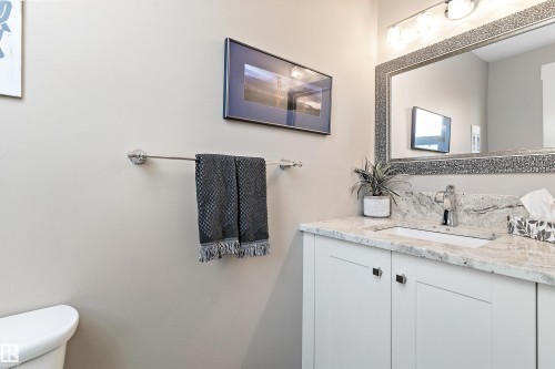Bathroom with vanity and toilet - 317 Grand Meadow Crescent, Edmonton, AB - Indoor Photo Showing Bathroom