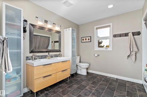 Full bathroom with double vanity and a shower with curtain - 317 Grand Meadow Crescent, Edmonton, AB - Indoor Photo Showing Bathroom