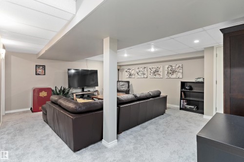 Living area with light colored carpet and recessed lighting - 317 Grand Meadow Crescent, Edmonton, AB - Indoor