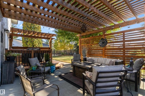 View of patio / terrace featuring an outdoor living space with a fire pit and a pergola - 317 Grand Meadow Crescent, Edmonton, AB - Outdoor With Deck Patio Veranda With Exterior