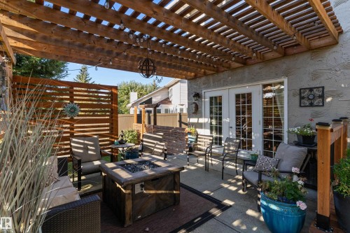 View of patio featuring french doors, an outdoor fire pit, and a pergola - 317 Grand Meadow Crescent, Edmonton, AB - Outdoor With Deck Patio Veranda