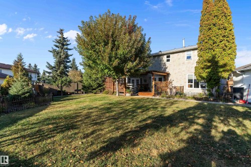 Back of property with a fenced backyard, a patio, and french doors - 317 Grand Meadow Crescent, Edmonton, AB - Outdoor