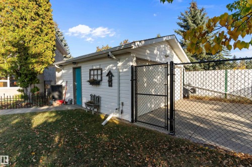 View of outdoor structure featuring a gate and a garage - 317 Grand Meadow Crescent, Edmonton, AB - Outdoor