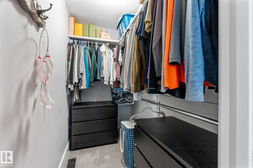 Primary Walk In Closet - 89 Hewitt Circle, Spruce Grove, AB - Indoor With Storage