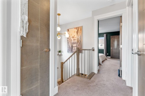 Hallway with carpet flooring and an upstairs landing - 89 Hewitt Circle, Spruce Grove, AB - Indoor Photo Showing Other Room