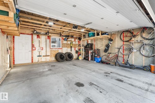 Double detached garage with back alley access - 89 Hewitt Circle, Spruce Grove, AB - Indoor Photo Showing Garage