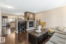 208 57 Street, Edmonton, AB  - Indoor Photo Showing Living Room With Fireplace 