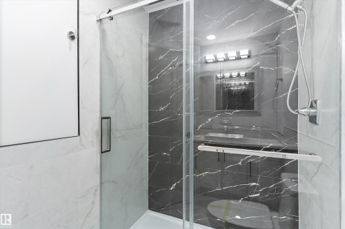 Full bathroom featuring a marble finish shower - 17116 81 Avenue, Edmonton, AB - Indoor Photo Showing Bathroom