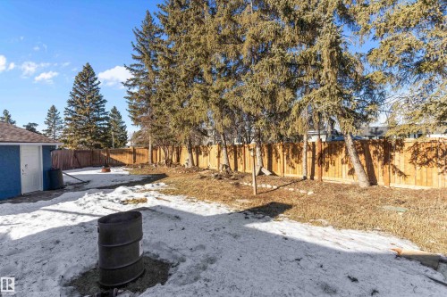 Snowy yard featuring a fenced backyard - 17116 81 Avenue, Edmonton, AB - Outdoor