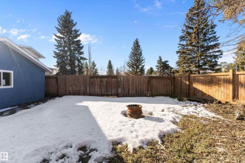 Fenced backyard featuring a fire pit - 17116 81 Avenue, Edmonton, AB - Outdoor