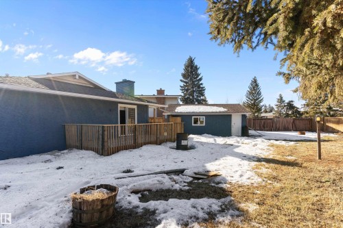 Snow covered rear of property with a chimney and an outbuilding - 17116 81 Avenue, Edmonton, AB - Outdoor