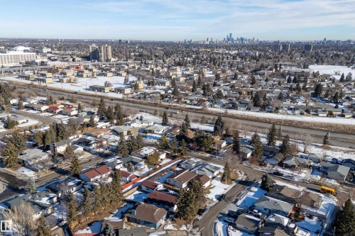 Aerial overview of property's location featuring city skyline and nearby suburban area - 17116 81 Avenue, Edmonton, AB - Outdoor With View