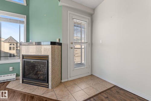 407 5204 25 Avenue, Edmonton, AB - Indoor Photo Showing Other Room With Fireplace