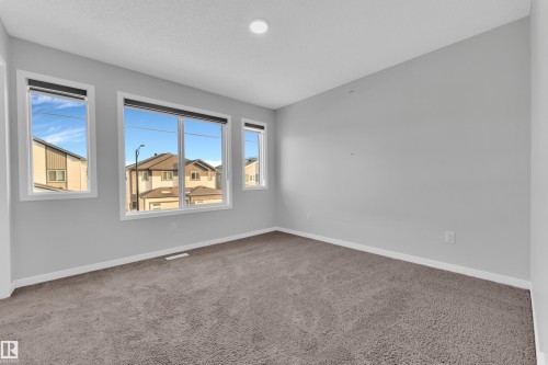 Unfurnished room featuring baseboards and carpet floors - 1235 16 Avenue, Edmonton, AB - Indoor Photo Showing Other Room