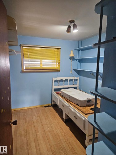 Bedroom with light wood-type flooring and baseboards - 5314 57 Street, Cold Lake, AB - Indoor