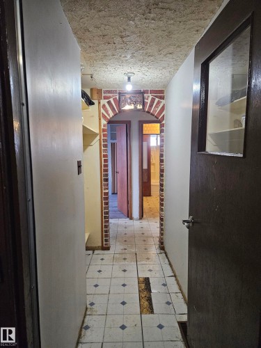 Hall featuring light flooring and arched walkways - 5314 57 Street, Cold Lake, AB - Indoor Photo Showing Other Room