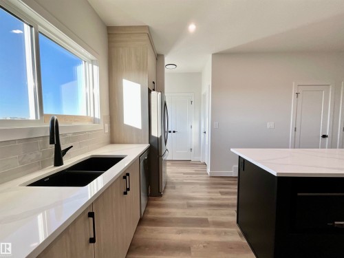 63 Sienna Boulevard, Fort Saskatchewan, AB - Indoor Photo Showing Kitchen With Double Sink