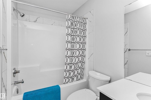 Bathroom with shower / bathtub combination with curtain and vanity - 3108 158 Street, Edmonton, AB - Indoor Photo Showing Bathroom