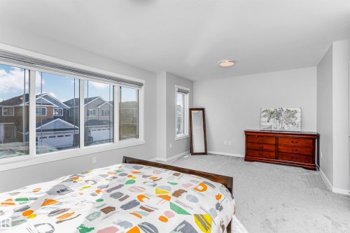 Bedroom featuring light carpet and baseboards - 3108 158 Street, Edmonton, AB - Indoor Photo Showing Bedroom
