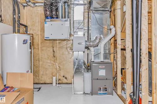 Utilities featuring water heater and heating unit - 3108 158 Street, Edmonton, AB - Indoor Photo Showing Basement
