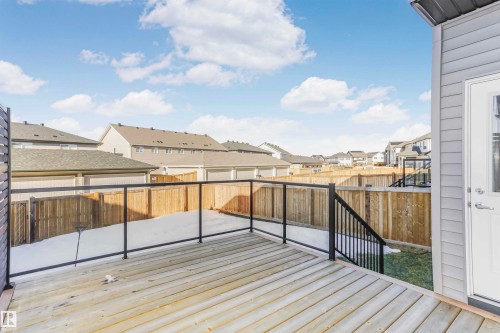 Wooden terrace featuring a residential view and a fenced backyard - 3108 158 Street, Edmonton, AB - Outdoor With Deck Patio Veranda With Exterior