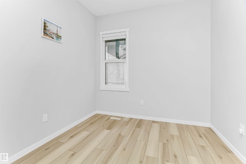 Empty room with light wood-type flooring and baseboards - 3108 158 Street, Edmonton, AB - Indoor Photo Showing Other Room