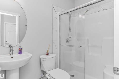 Bathroom with toilet and a shower stall - 3108 158 Street, Edmonton, AB - Indoor Photo Showing Bathroom