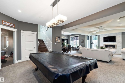 3054 Watson Landing Sw, Edmonton, AB - Indoor Photo Showing Other Room With Fireplace