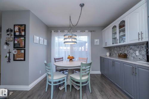 Dining room with dark wood finished floors - 4371 46 Street, Stony Plain, AB - Indoor Photo Showing Dining Room
