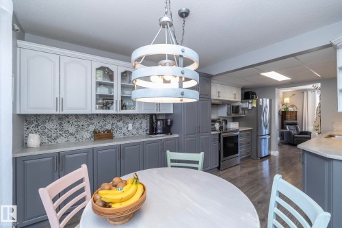 Dining space featuring dark wood-type flooring - 4371 46 Street, Stony Plain, AB - Indoor Photo Showing Dining Room