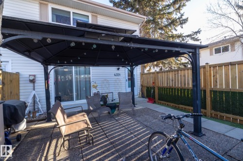 Fenced backyard with a patio, a gazebo, and grilling area - 4371 46 Street, Stony Plain, AB - Outdoor With Exterior