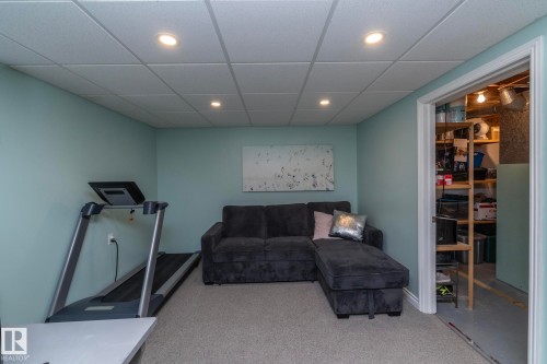 Exercise room featuring a drop ceiling, recessed lighting, and carpet - 4371 46 Street, Stony Plain, AB - Indoor