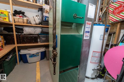 Utilities featuring water heater and heating unit - 4371 46 Street, Stony Plain, AB - Indoor Photo Showing Basement
