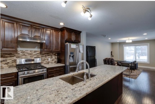 10935 76 Avenue, Edmonton, AB - Indoor Photo Showing Kitchen With Double Sink With Upgraded Kitchen
