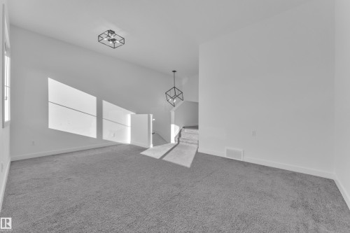 Unfurnished room with light colored carpet and baseboards - 1822 Collip View View, Edmonton, AB - Indoor Photo Showing Other Room