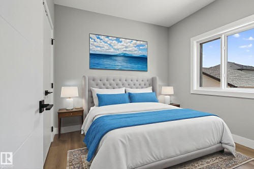 Bedroom featuring wood finished floors - 456 Crystal Creek Link, Leduc, AB - Indoor Photo Showing Bedroom
