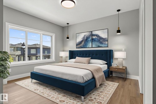 Bedroom featuring wood finished floors and baseboards - 456 Crystal Creek Link, Leduc, AB - Indoor Photo Showing Bedroom