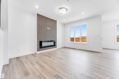 123 28 Street, Edmonton, AB - Indoor Photo Showing Other Room With Fireplace