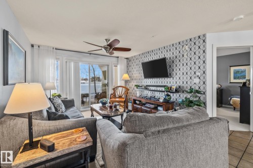 120 278 Suder Greens Drive, Edmonton, AB - Indoor Photo Showing Living Room With Fireplace