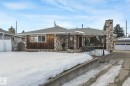 View of front facade featuring a shingled roof and stone siding - 10324 42 Street, Edmonton, AB  - Outdoor 
