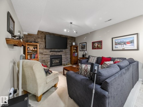 220 Ronning Close, Edmonton, AB - Indoor Photo Showing Living Room With Fireplace