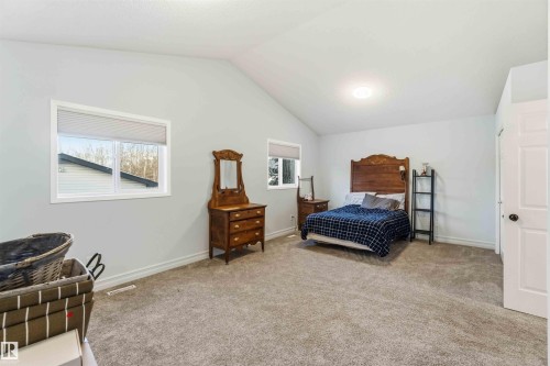 Bedroom featuring light colored carpet - 1706 Turvey Bend, Edmonton, AB - Indoor Photo Showing Bedroom