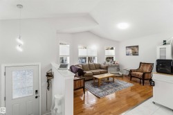 Living area with light wood-type flooring - 