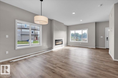 43 Eton Link, Spruce Grove, AB - Indoor Photo Showing Living Room With Fireplace