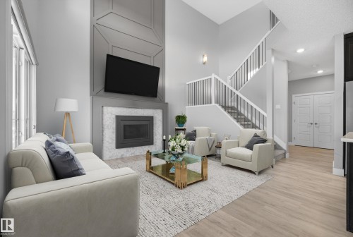 *VIRTUALLY STAGED - 1523 Darby Bay, Edmonton, AB - Indoor Photo Showing Living Room With Fireplace