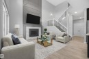 *VIRTUALLY STAGED - 1523 Darby Bay, Edmonton, AB  - Indoor Photo Showing Living Room With Fireplace 